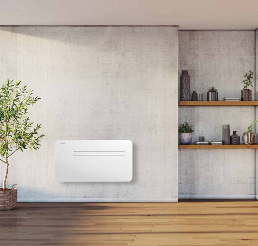 Climatiseur monobloc Panasonic RAC Solo blanc installé en partie basse d’un mur de salon